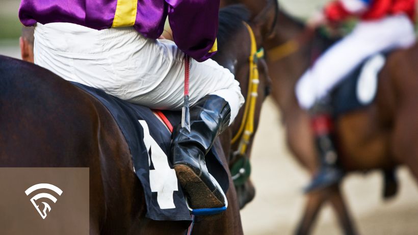 Close up photo of jockey on a horse