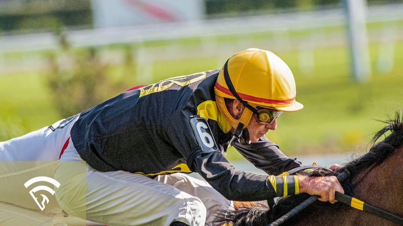 Close up view of a jockey on a horse