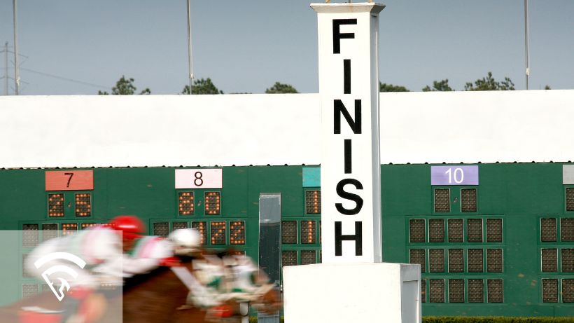Close up view of a horse race finish line representing a claiming tag