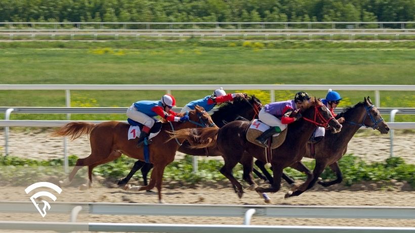 Horses and jockeys racing representing the topic of data leakage in horse racing models